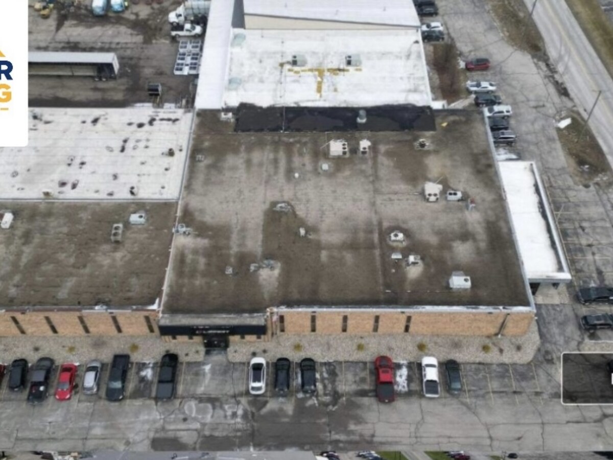 Aerial view of aged industrial warehouse roof before Pioneer replacement