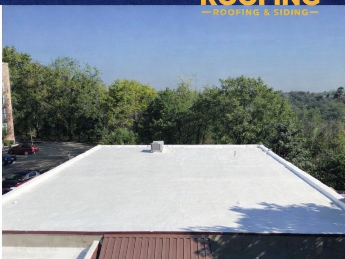 Bright white silicone-restored commercial roof after Pioneer elastomeric coating
