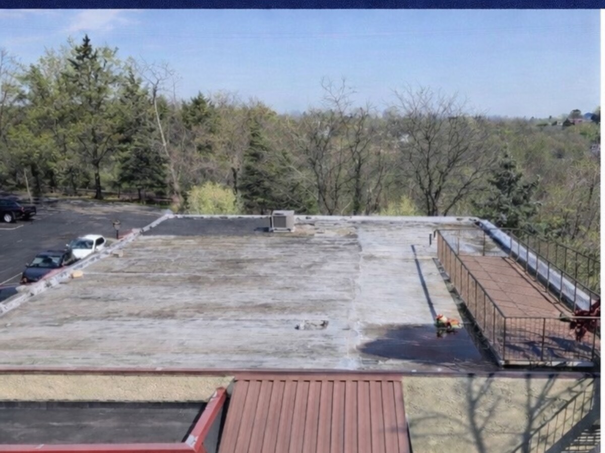 Weathered commercial metal flat roof before silicone restoration in Cherry Hill, NJ