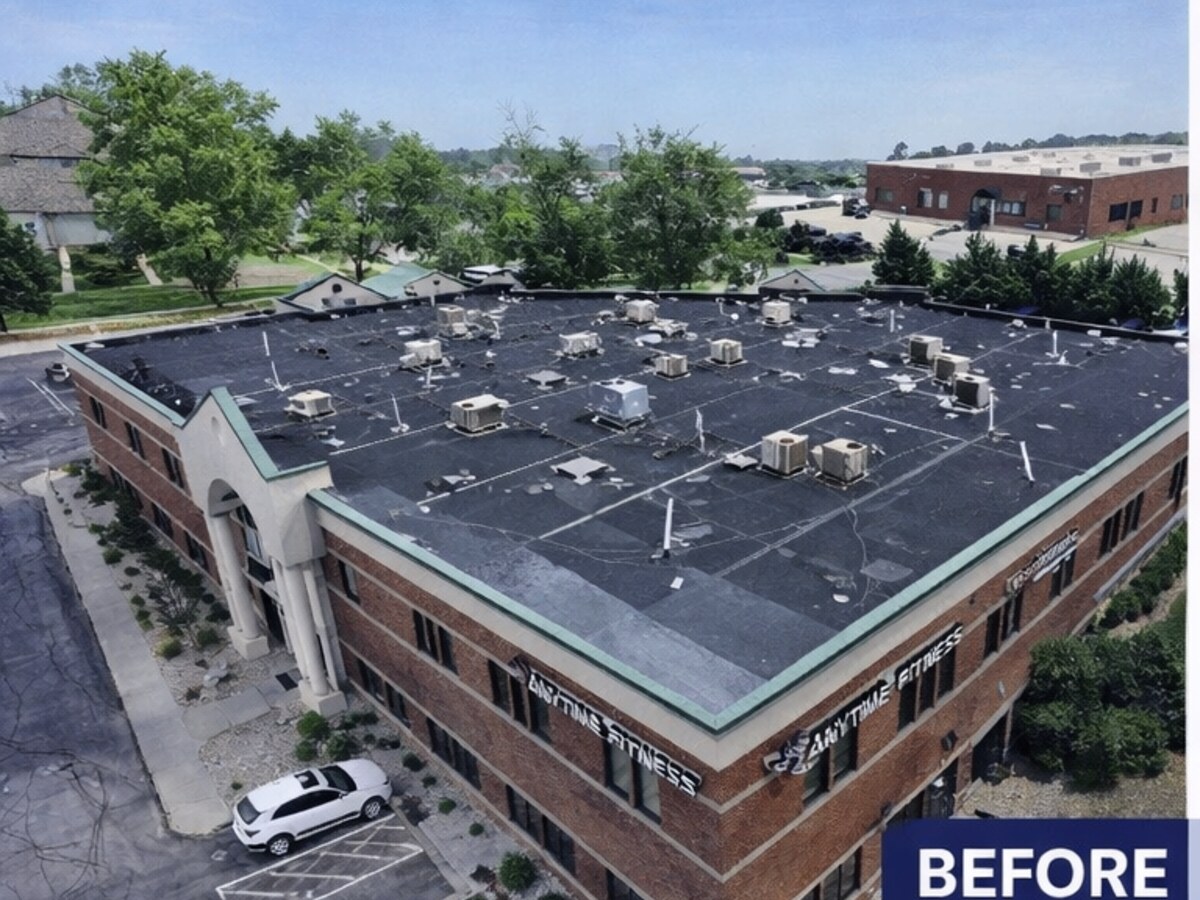 Aged dark flat roof before TPO membrane replacement in Mount Laurel, NJ